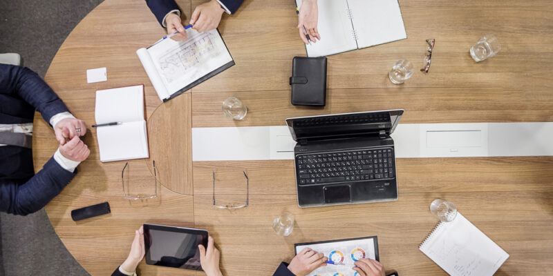 Business People Meeting Conference Discussion Corporate Concept,business team,business partners discussing documents and ideas,Business conference in a modern office,close up,top view
